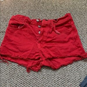 Red frayed Brandy Melville shorts.